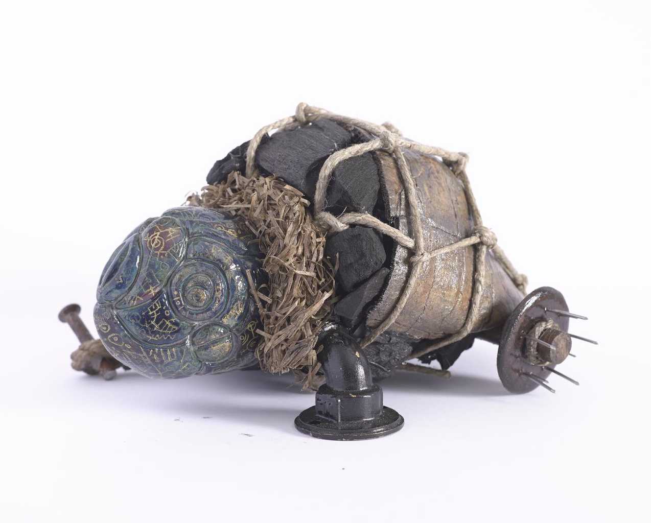 Marios Fournaris, Post-Industrial Artefact Of The Intercultural Perception N.01, ceramic, charcoal, wood, iron, jute, hay, brass, 2016