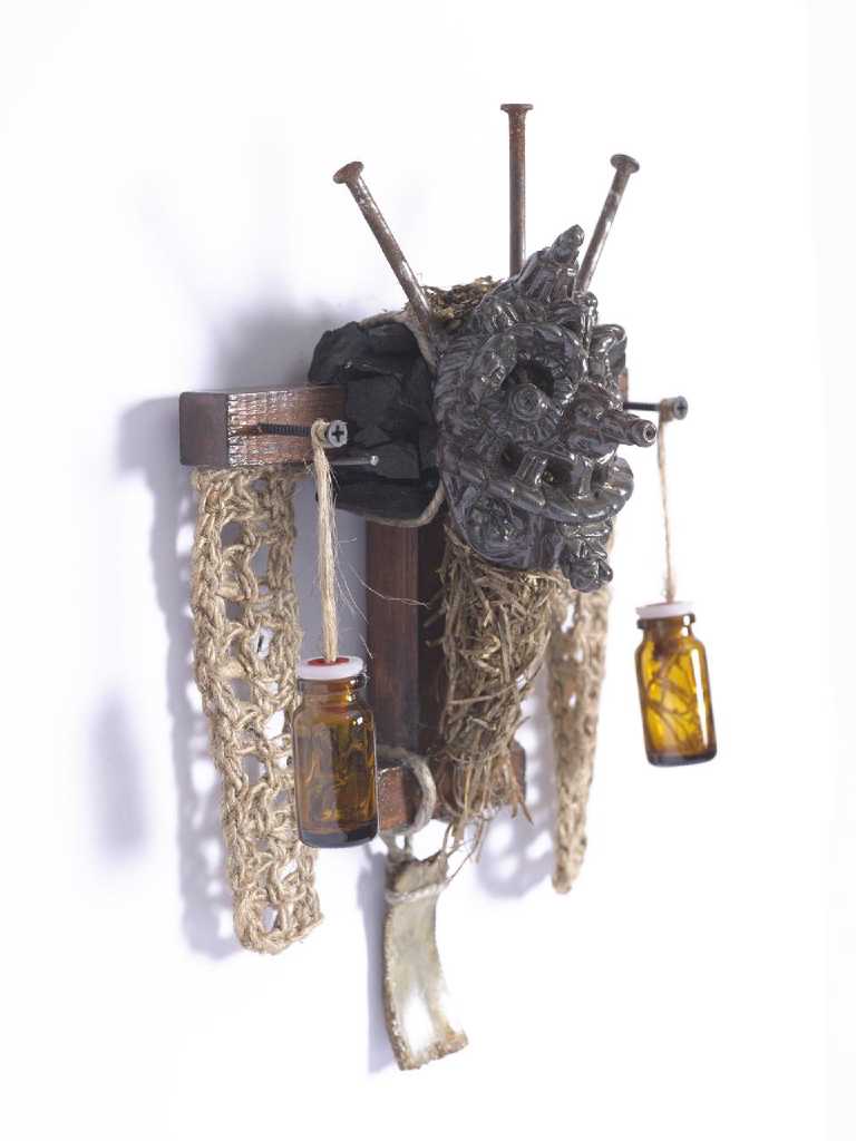 Marios Fournaris, Untitled, ceramic mask, hay, jute, bone, glass, wood, iron, charcoal, 2017