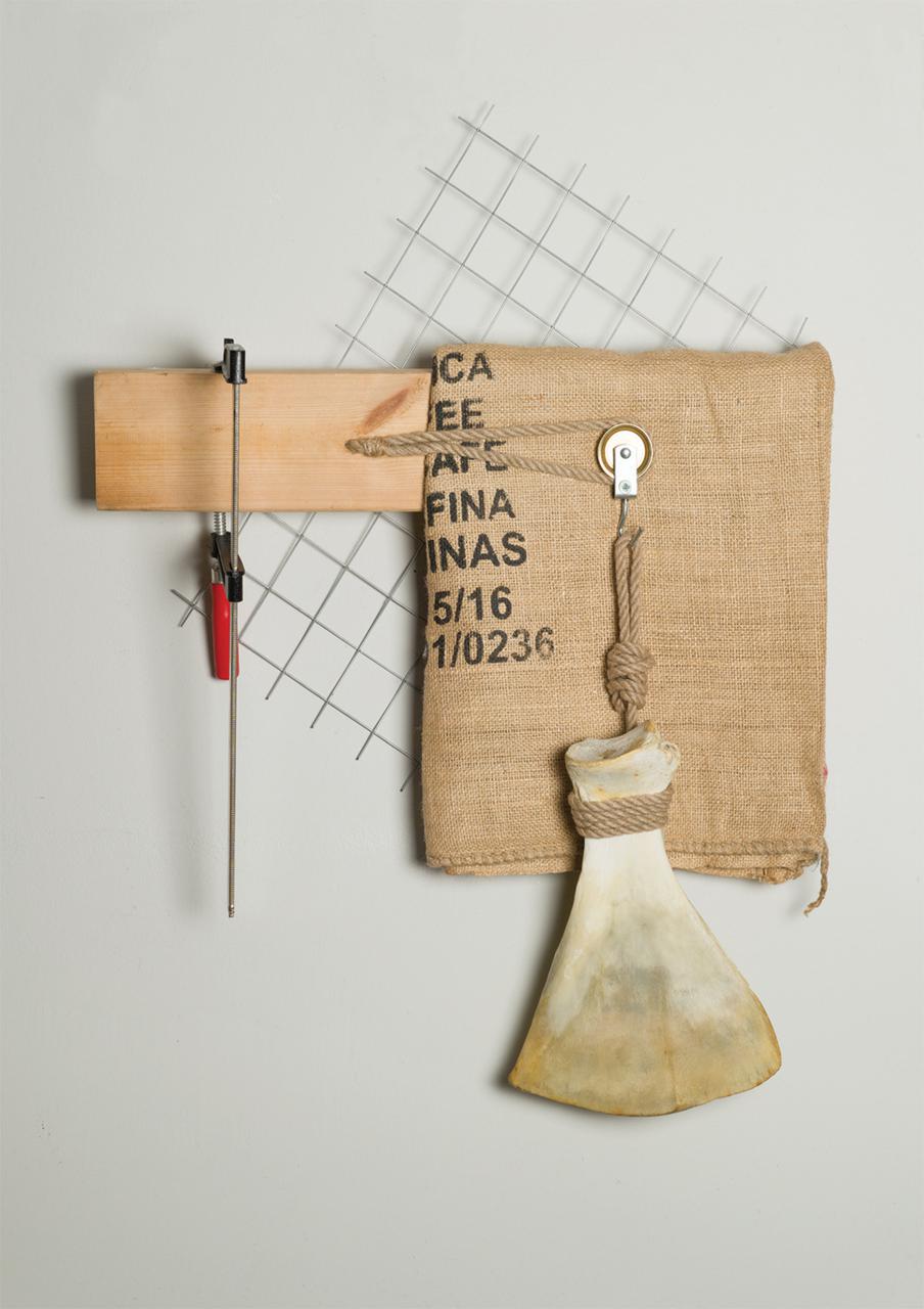 Untitled, 67 cm x 64 cm x 15 cm, wood, iron, woodworking tool, burlap sack, bone, 2018